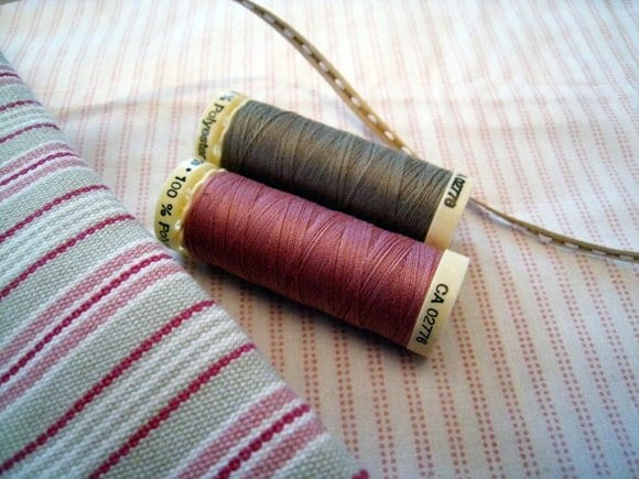 pink-gray-striped-cotton-fabric-spools-of-thread pink-gray-striped-cotton-fabric-spools-of-thread