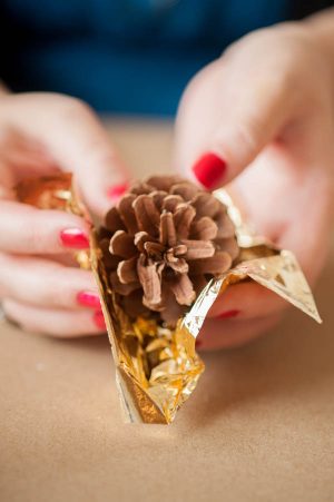 DIY gold leaf pine cone garland from The Sweetest Occasion | Photo by Alice G Patterson DIY gold leaf pine cone garland from The Sweetest Occasion | Photo by Alice G Patterson